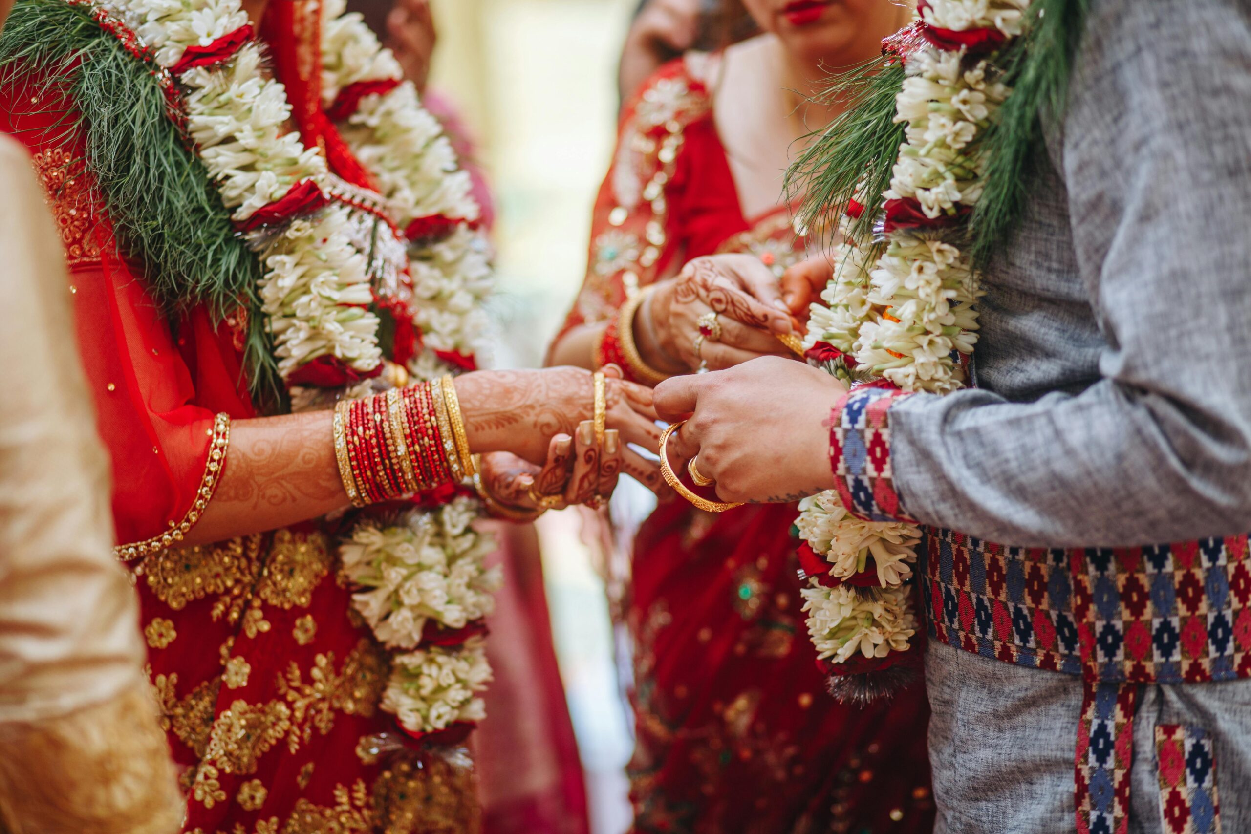Home Close-up of a traditional Indian wedding ceremony with intricate attire and rituals.
