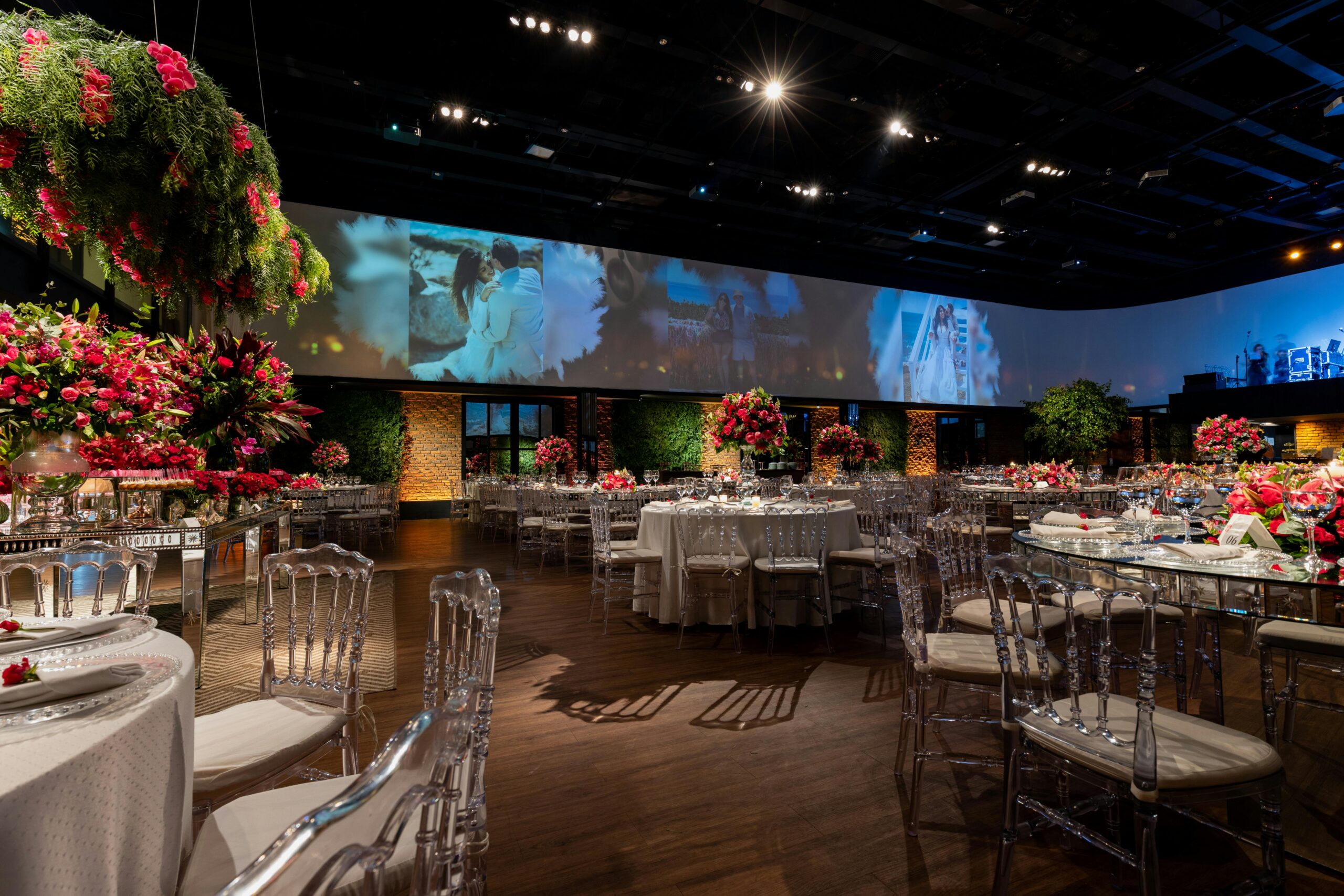 Lavish banquet hall setup for a wedding reception with beautifully adorned tables and chairs.